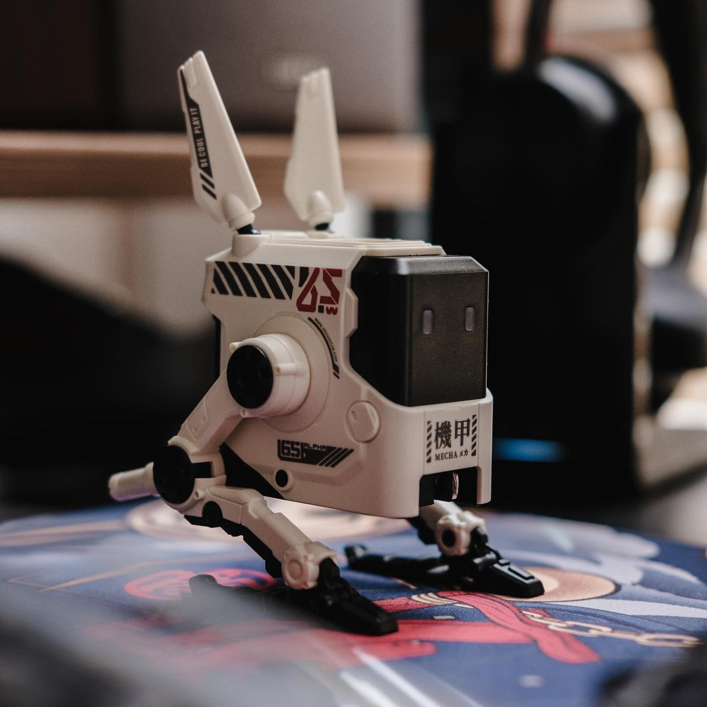 Toy robot model on a table with a blurred background