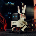 Toy robot with rabbit-like features in a dark, futuristic setting
